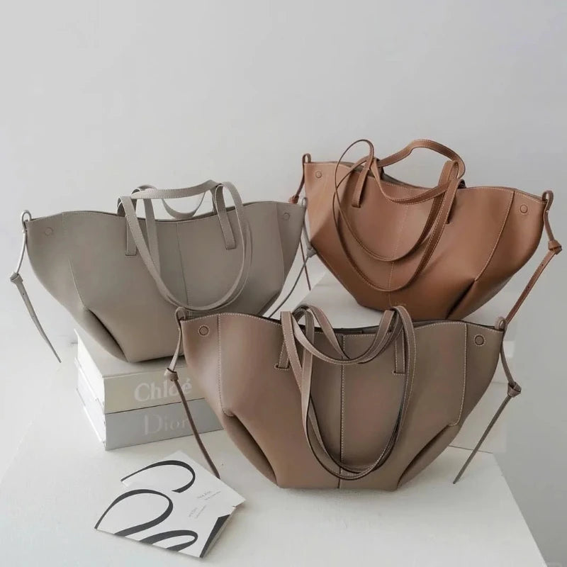 2026 new High quality wing bag, one shoulder hand-held armpit tote bag, cowhide bucket bag, large capacity leather bag