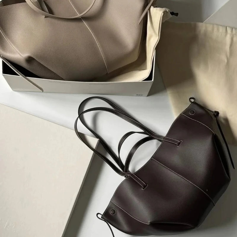 2026 new High quality wing bag, one shoulder hand-held armpit tote bag, cowhide bucket bag, large capacity leather bag